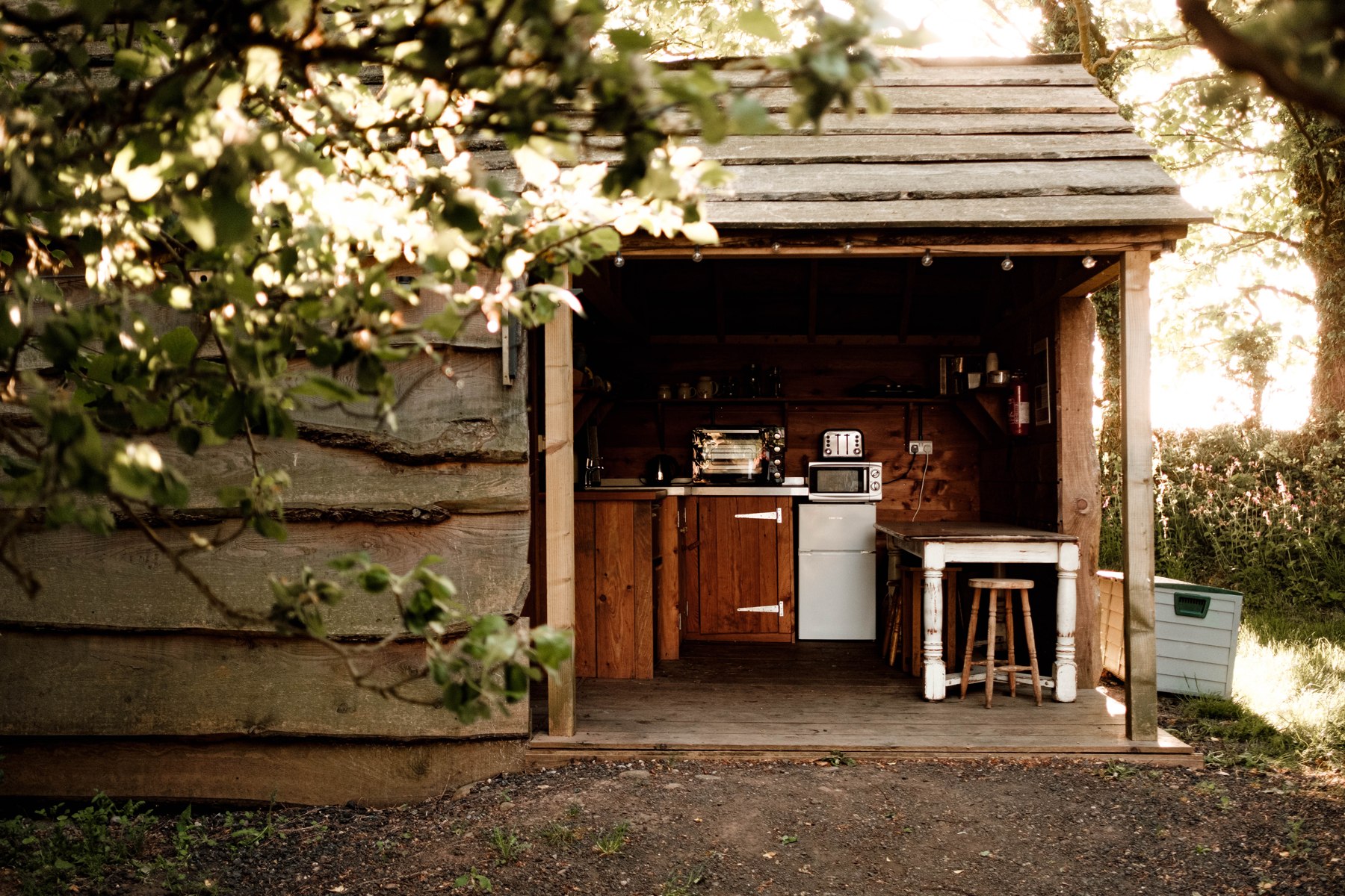 The separate timber kitchen building shared by Ginger Hut and Mushroom Hut
