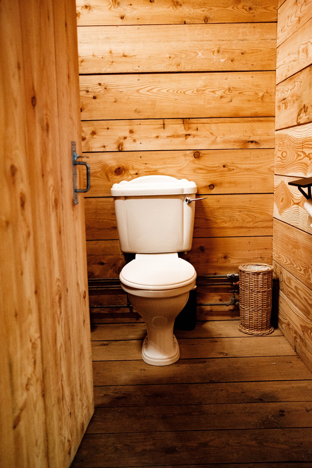 Toilet in the separate timber-lined shared facilities