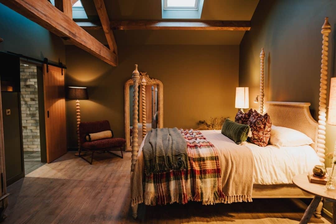 The warmly styled main bedroom in Patty’s Croft