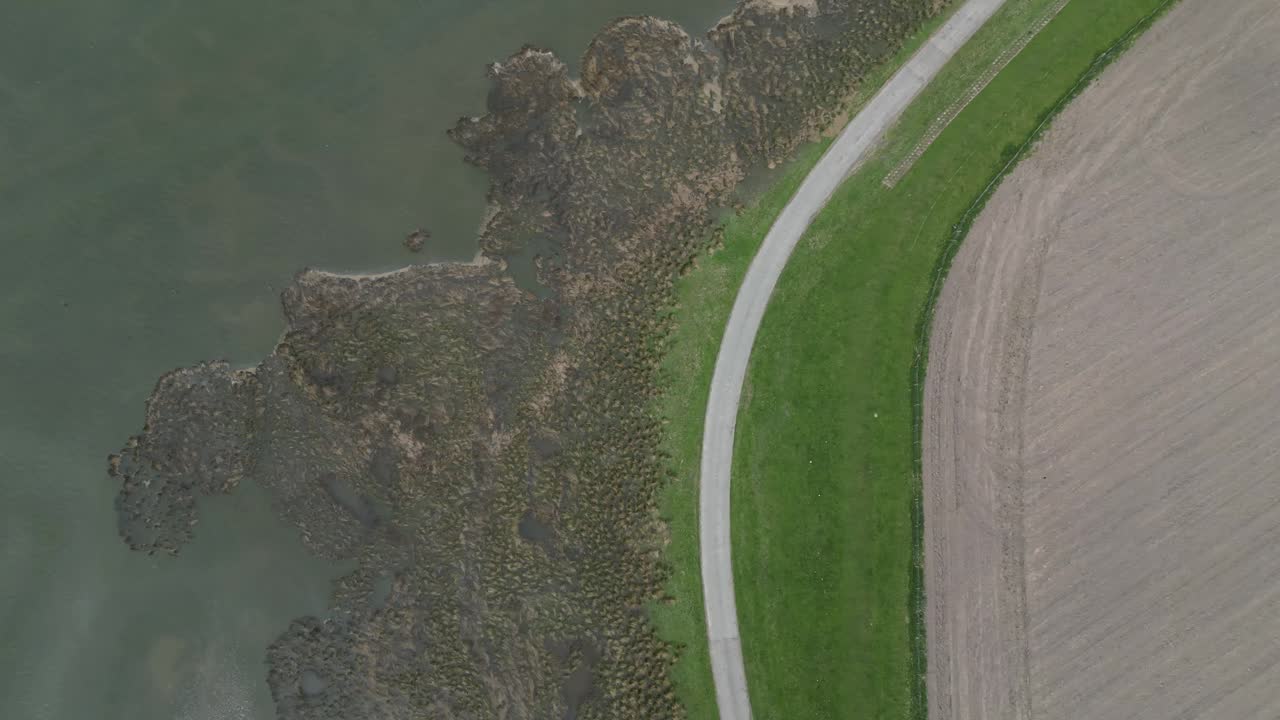 Aerial view of the road into Patty’s Barn beside the salt marshes