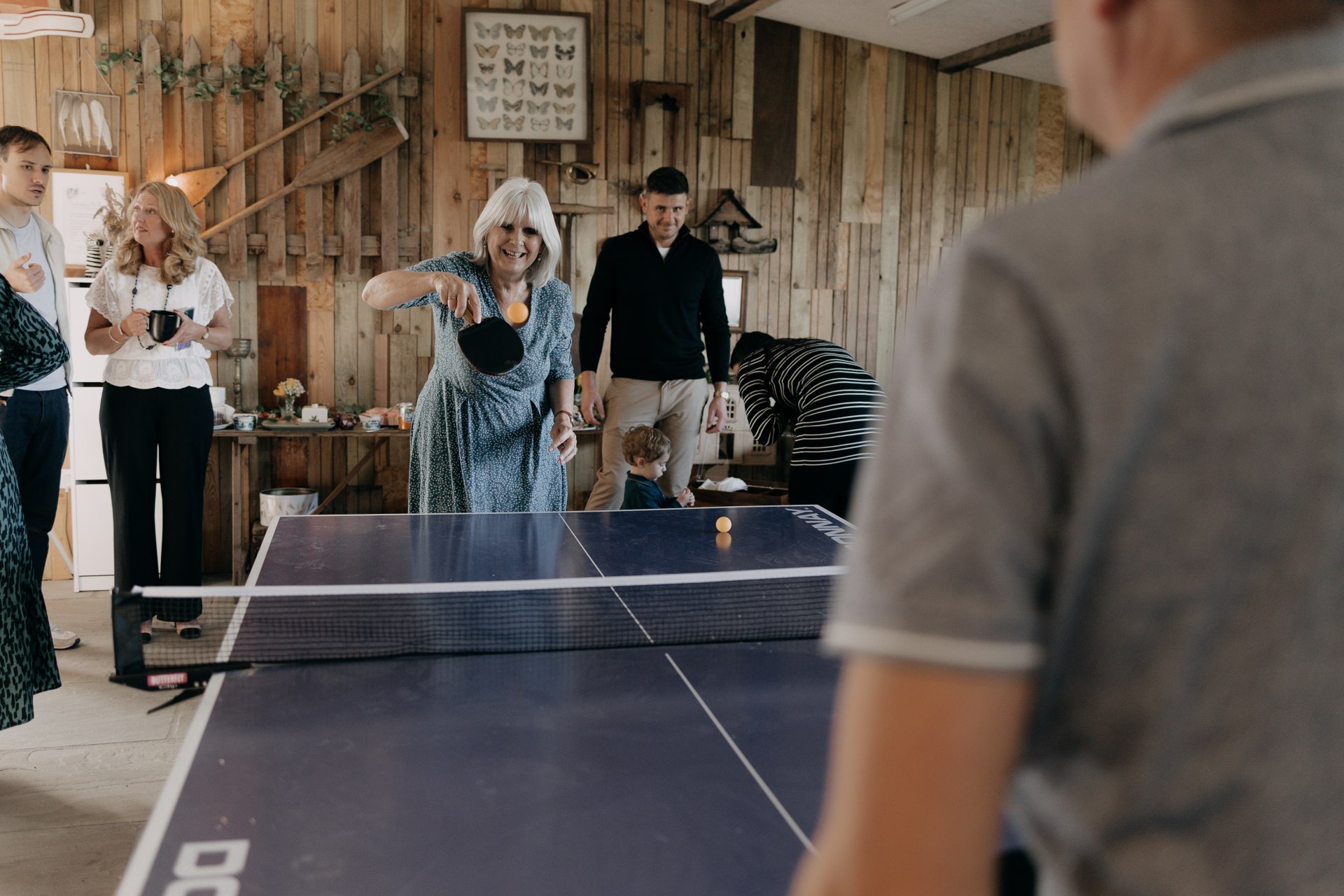 Guests enjoying table tennis together during a celebration at Patty’s Barn